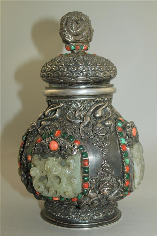 A Tibetan silver, jade, coral, malachite and turquoise mounted ritual jar and cover, 19th century, 25.5cm